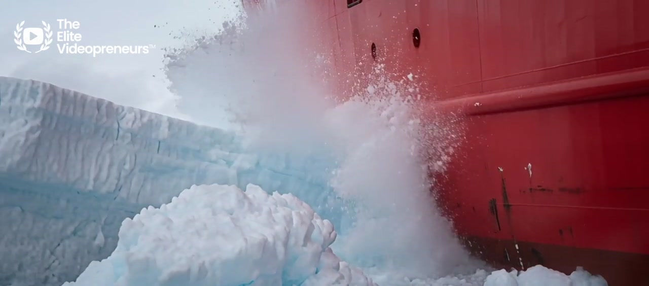 Red ship crossing a wide field of sea ice